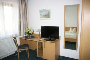 TV a/nebo společenská místnost v ubytování Hotel Jagermo