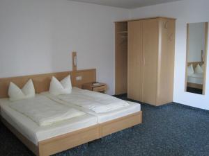 Postel nebo postele na pokoji v ubytování Hotel Jagermo