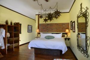 Postel nebo postele na pokoji v ubytování Posada de las Flores La Paz