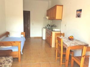 A kitchen or kitchenette at Alexandros Studios Még 37 kép