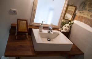 a white sink in a bathroom with a window at Da Rita in San Terenzo