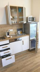 Kuchyň nebo kuchyňský kout v ubytování Apartmenthotel Kaiser Karl