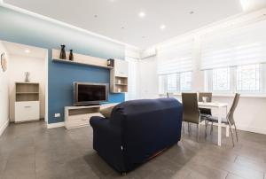 a living room with a couch and a table at Casa Paestum. Your wonderful garden in Rome in Rome