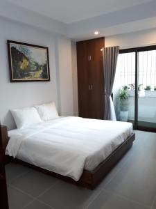 Giường trong phòng chung tại Blue Home Serviced Apartment Hanoi