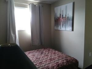 Postel nebo postele na pokoji v ubytování Aries Motel