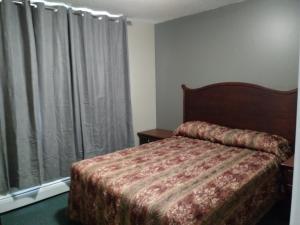 Postel nebo postele na pokoji v ubytování Aries Motel