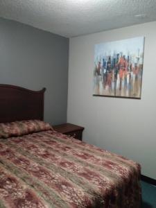 Postel nebo postele na pokoji v ubytování Aries Motel