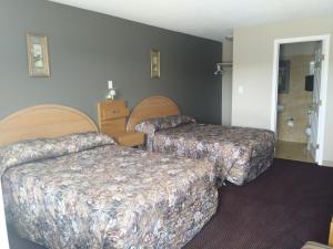 Postel nebo postele na pokoji v ubytování Aries Motel + 16 fotografií