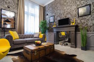 Televízia a/alebo spoločenská miestnosť v ubytovaní Viktoria Luxury Apartment
