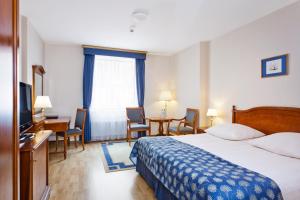 Posteľ alebo postele v izbe v ubytovaní Qubus Hotel Wrocław