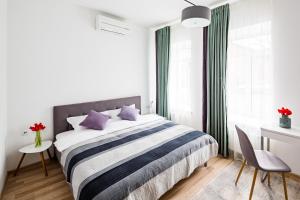 Кровать или кровати в номере Apart Hotel Code 10