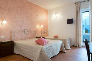 Letto o letti in una camera di CORTE DELL'IMMACOLATA AL MARE