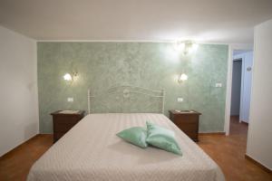Letto o letti in una camera di CORTE DELL'IMMACOLATA AL MARE