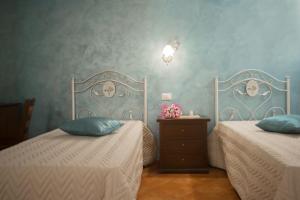 Letto o letti in una camera di CORTE DELL'IMMACOLATA AL MARE