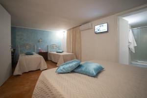 Letto o letti in una camera di CORTE DELL'IMMACOLATA AL MARE