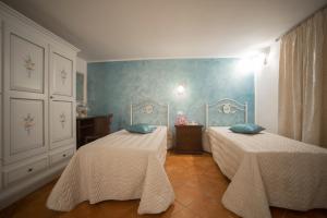 Letto o letti in una camera di CORTE DELL'IMMACOLATA AL MARE