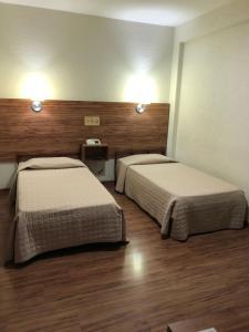 Ένα ή περισσότερα κρεβάτια σε δωμάτιο στο Hotel Globo Rio