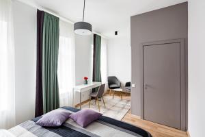 Кровать или кровати в номере Apart Hotel Code 10