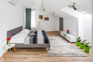 Кровать или кровати в номере Apart Hotel Code 10