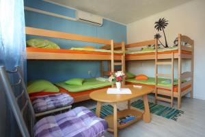 Postel nebo postele na pokoji v ubytování Guesthouse Adi
