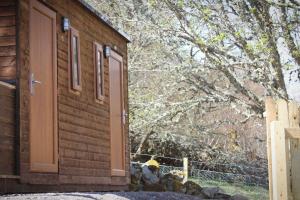 a door to a house with stuffed animals next to it at Howe of Torbeg in Ballater