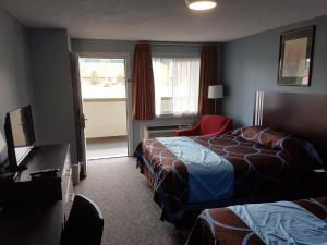 Postel nebo postele na pokoji v ubytování BA Hotel