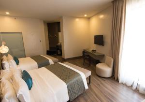 TV a/nebo společenská místnost v ubytování Goldberry Lite Hotel