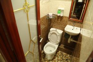 a bathroom with a toilet and a sink at European Hostel in Hong Kong