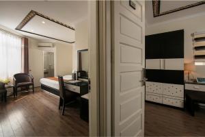 Ένα ή περισσότερα κρεβάτια σε δωμάτιο στο Serenity Diamond Hotel