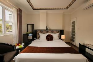 Ένα ή περισσότερα κρεβάτια σε δωμάτιο στο Serenity Diamond Hotel