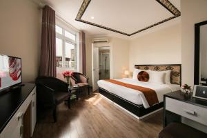Ένα ή περισσότερα κρεβάτια σε δωμάτιο στο Serenity Diamond Hotel