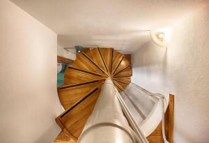 a view from the top of a spiral staircase in a room at Duomo-City Life In The Heart Of The City! in Milan