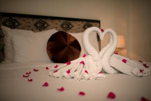 Ένα ή περισσότερα κρεβάτια σε δωμάτιο στο Serenity Diamond Hotel