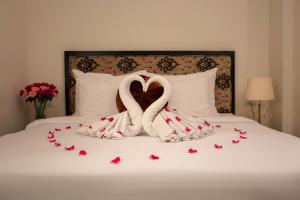 Ένα ή περισσότερα κρεβάτια σε δωμάτιο στο Serenity Diamond Hotel