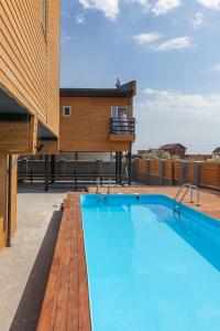 a swimming pool on the roof of a house at Villa Solomare in Zatoka