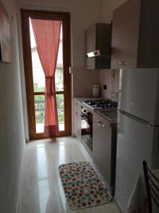 Kuchyň nebo kuchyňský kout v ubytování B&B Figura Apartments