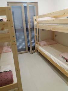 Una cama o camas cuchetas en una habitación  de Villa Sabaudia