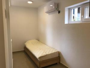 Postel nebo postele na pokoji v ubytování Vip Apartmani Canj