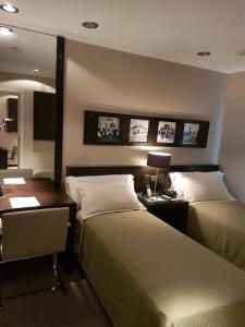 Ένα ή περισσότερα κρεβάτια σε δωμάτιο στο Hotel Resort Posta De Juarez