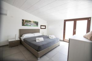 Ένα ή περισσότερα κρεβάτια σε δωμάτιο στο Ville Edilia Vacanze +68 φωτογραφίες