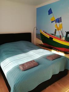Łóżko lub łóżka w pokoju w obiekcie Osińscy