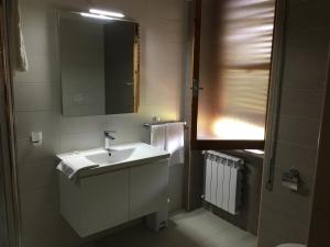 a bathroom with a sink and a mirror at La casa del Moro in Sabaudia