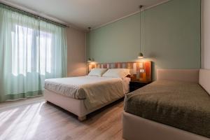 Postel nebo postele na pokoji v ubytování B&B L'Eroico