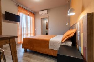 Postel nebo postele na pokoji v ubytování B&B L'Eroico