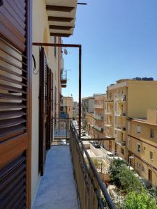 a balcony with a view of a city at Backpackers in Agrigento
