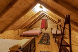Postel nebo postele na pokoji v ubytování Ethno Lodge AB