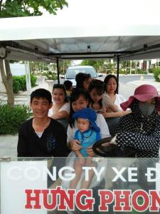 a group of people sitting in the back of a truck at Biệt thự Sao Biển - SB118 FLC Sầm Sơn Resort in Sầm Sơn