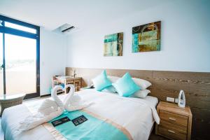 Katil atau katil-katil dalam bilik di Palau Hotel