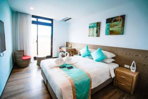 Katil atau katil-katil dalam bilik di Palau Hotel