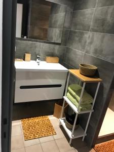 a bathroom with a sink and a mirror at Le Domaine Vermeil in Argelès-sur-Mer +20 photos
